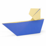 Origami man in a boat
