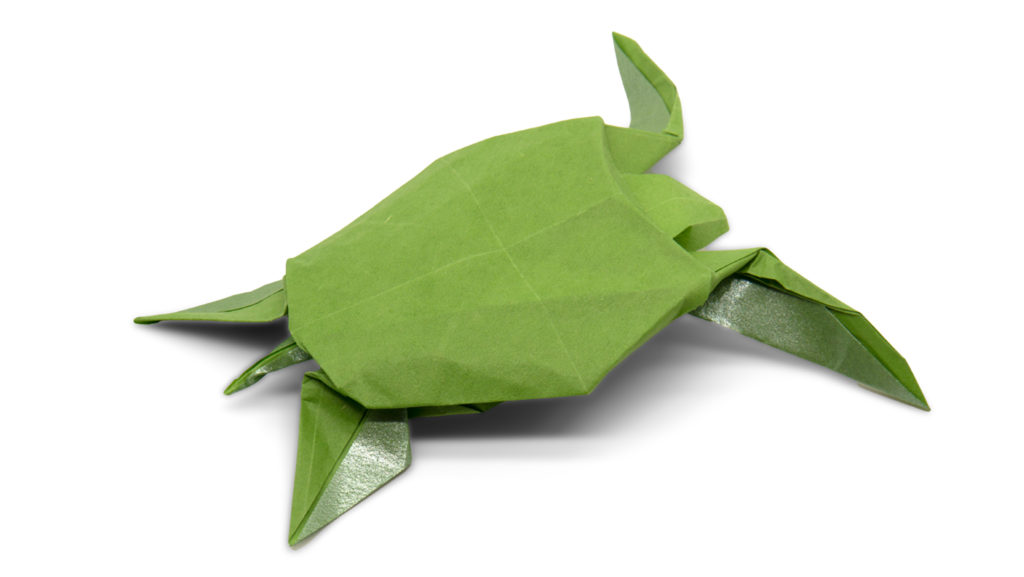 origami sea turtle designed by red paper from the book pure origami