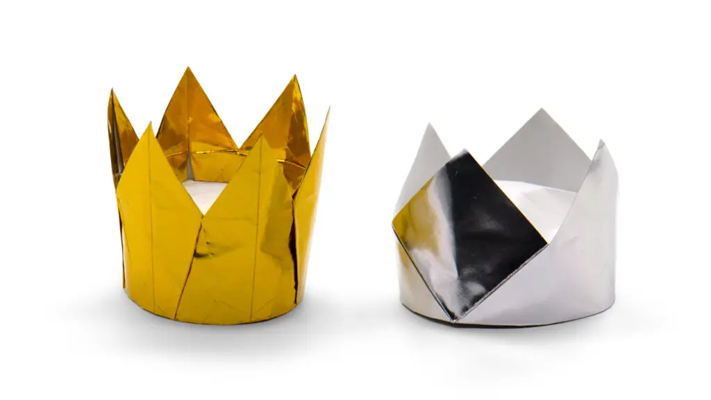 the six pointed crown in gold next to the traditional origami crown in silver