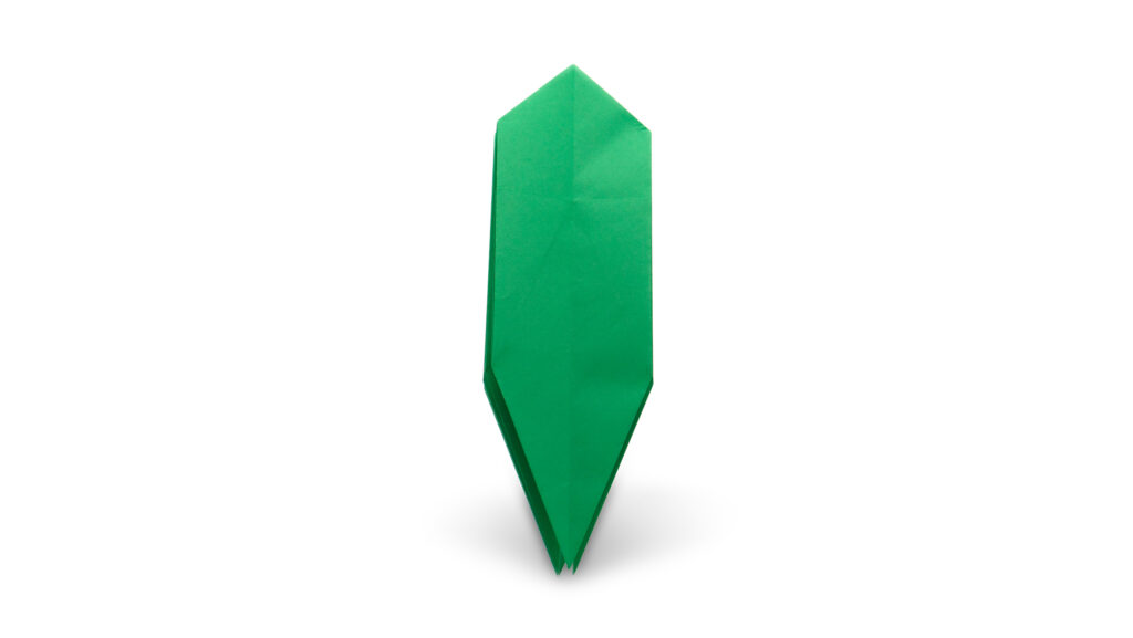 green folded paper which will enventually become siesta by neal elias